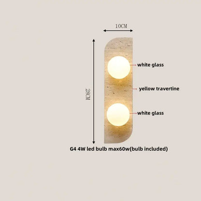 A modern yellow travertine led wall lamp with two glowing white glass spheres for bedroom lighting