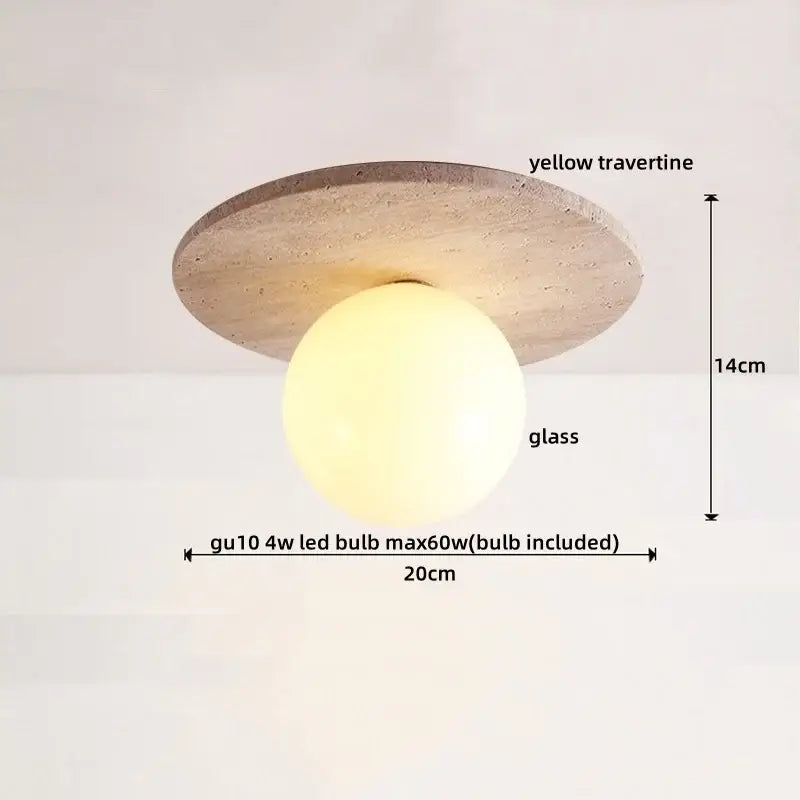 A modern ceiling light with a circular yellow travertine base and spherical glass globe by decorbites led wood for dining room