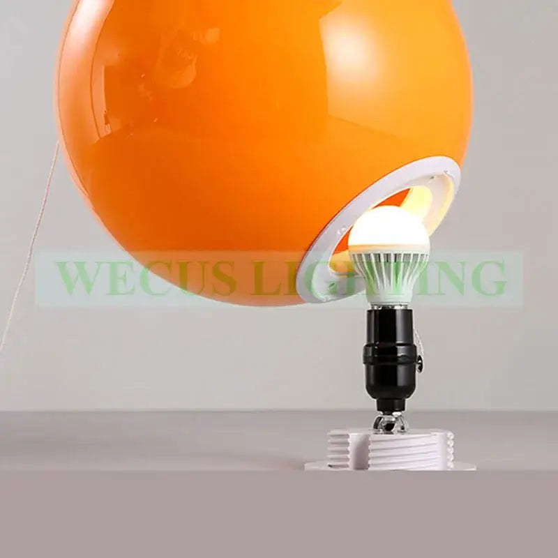 Modern yellow white and gray balloon light featuring a vibrant orange d200mm balloon light with white led bulb and black base