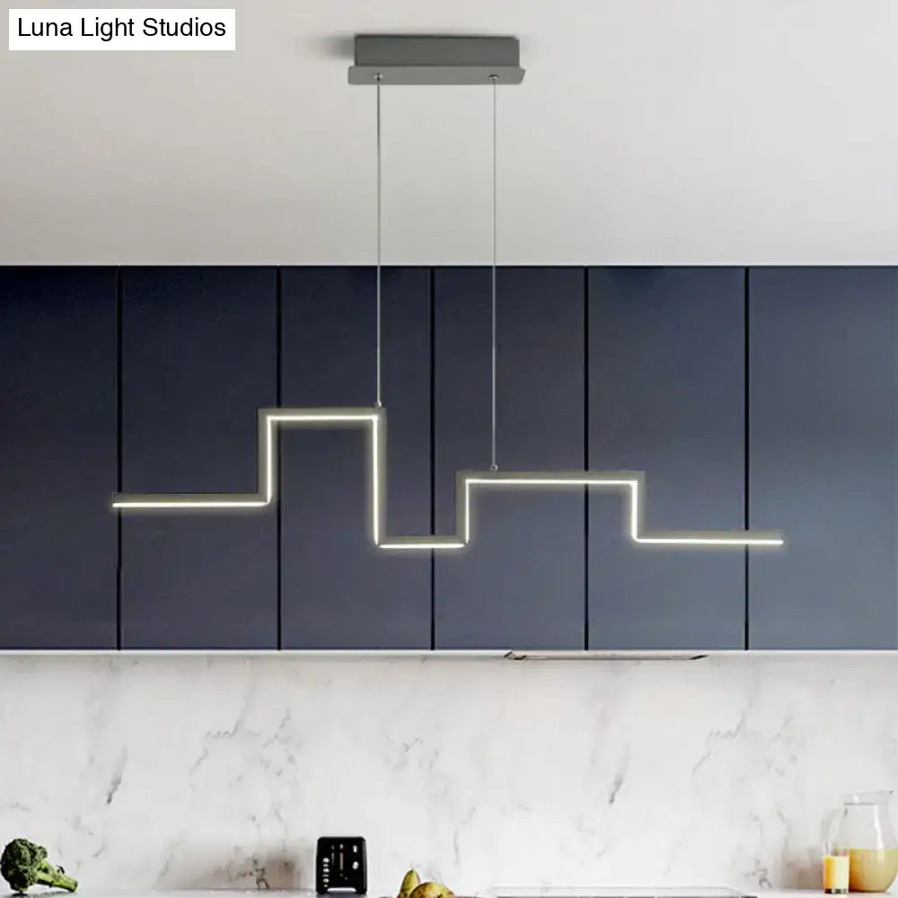 Modern zigzag linear metal hanging light fixture with sleek illuminated strips in a metal hanging light for dining room
