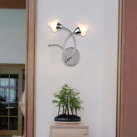 Modern wall lamp with chrome finish and frosted glass shades featuring two curved arms for 220v-240v use