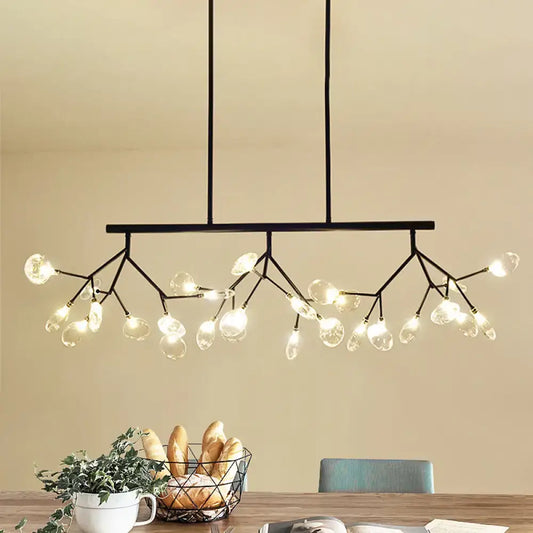 Black metal firefly hanging island chandelier with branching arms and clear modernist glass globe bulbs in black gold