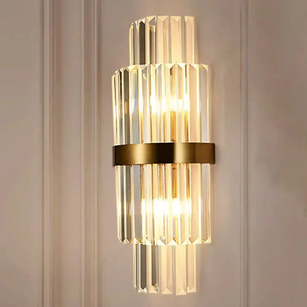 Modernist gold and clear crystal cylinder wall lighting fixture with stacked faceted rods for living room use