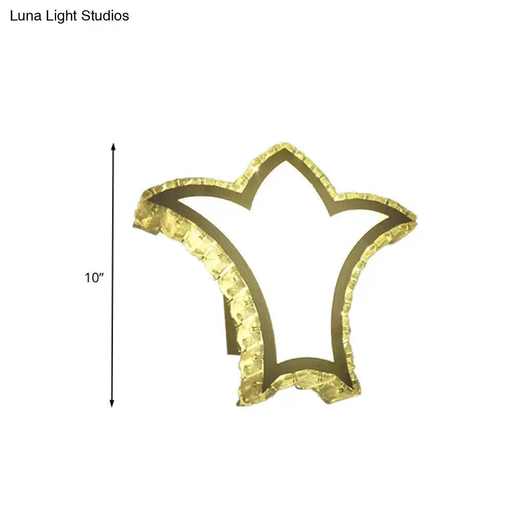 Modernist gold crown wall light with clear k9 crystal and textured faceted edges for bedroom decor