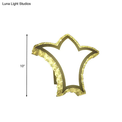 Modernist gold crown wall light with clear k9 crystal and textured faceted edges for bedroom decor