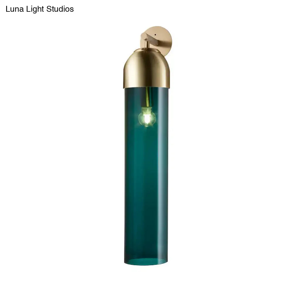 Modernist metallic tube sconce light with teal glass cylindrical shade and brass finish for bedroom use