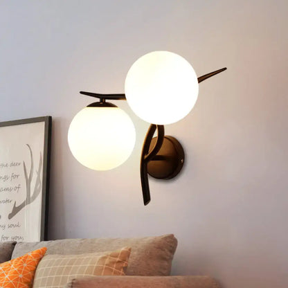 Modernist silver black light fixture with brass finish and milky glass globe shades for bedroom wall mounting