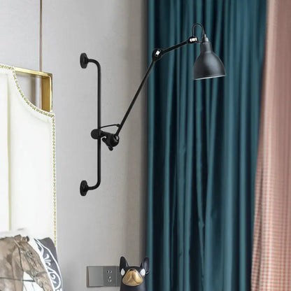 Black industrial-style adjustable wall light with matte finish and articulated arm in modernist style for dining room