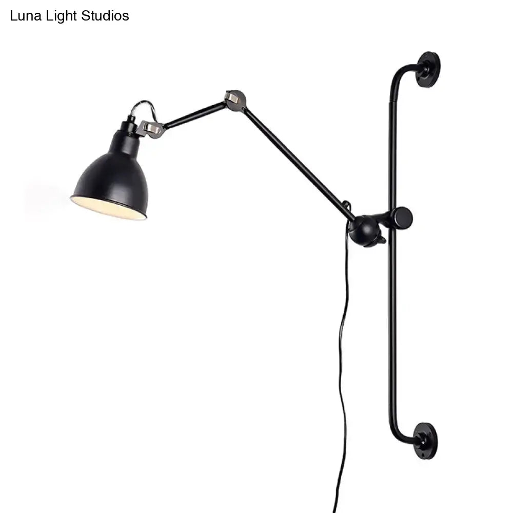 Modernist style black and white wall light with articulated arms and matte metal shade for dining room use