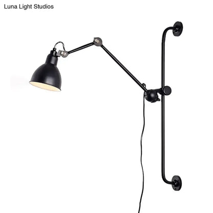 Modernist style black and white wall light with articulated arms and matte metal shade for dining room use