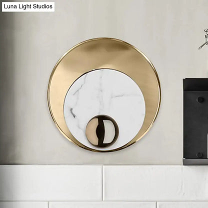 Modernist white black led sconce lighting with gold-toned round marble wall sconce and polished metallic sphere base