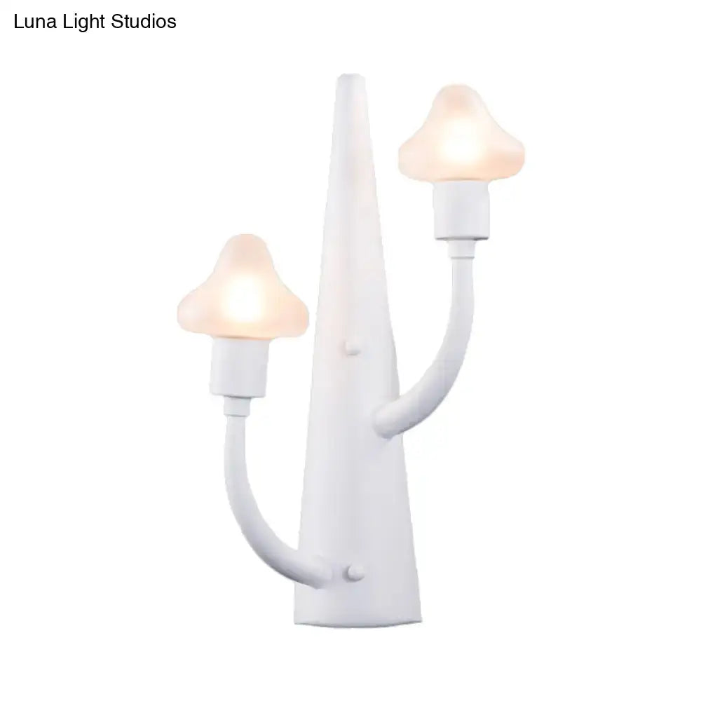 White wall-mounted sconce with mushroom opal glass shades and curved ceramic arms for living room lighting