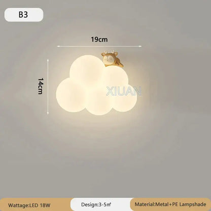 Soft white cloud cartoon wall lamp with golden deer figurine perched on top from monkey decorbites nursery decor