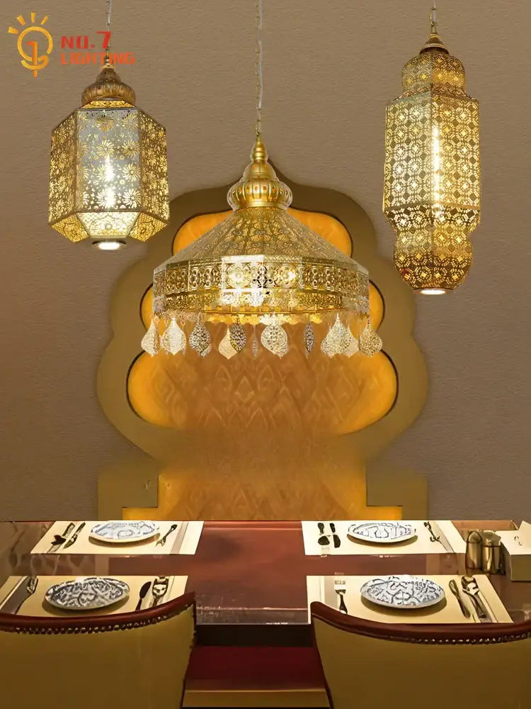 Moroccan gold lustre pendant lights with intricate cut-out patterns and crystal droplets for dining room decorbites gold lustre