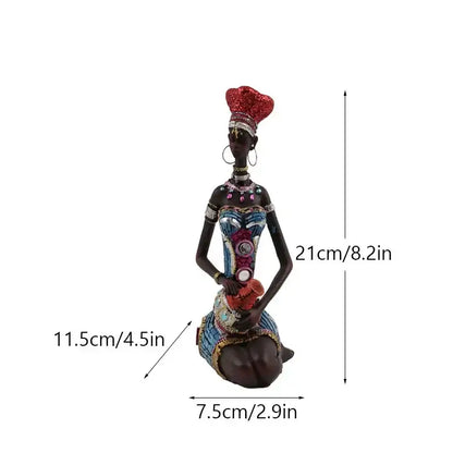 A mosaic african black women resin figurine with intricate beaded attire and a sparkling red headdress for living room decor