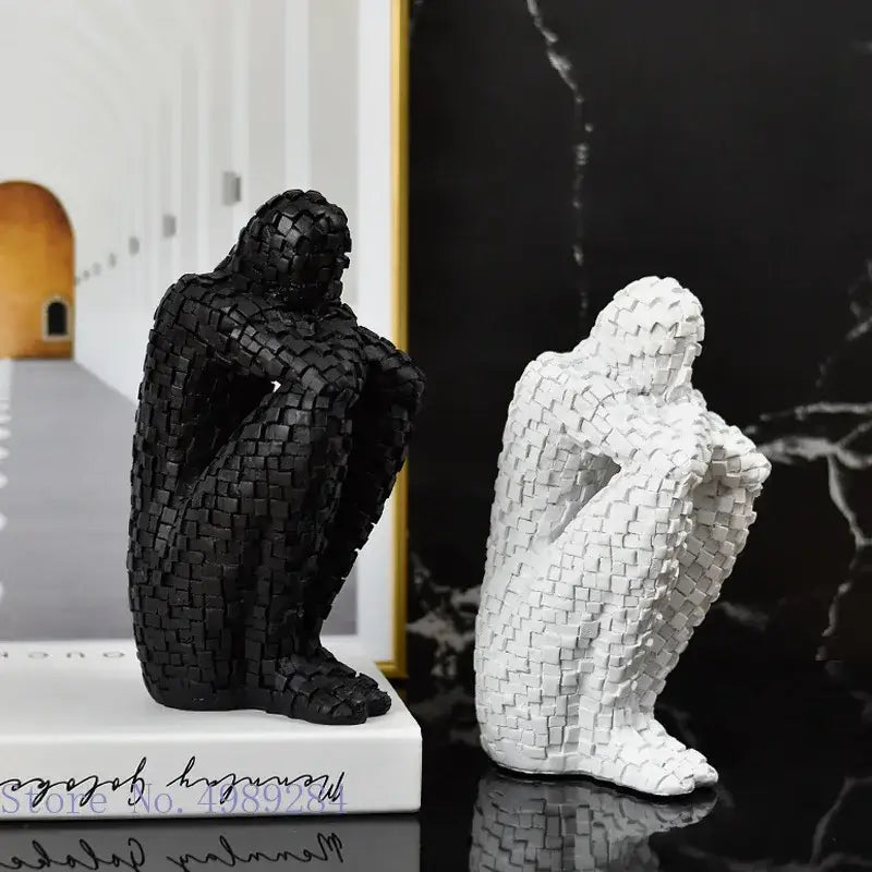 Black and white woven-textured resin figurines of golden man thinker abstract statues for living room decor