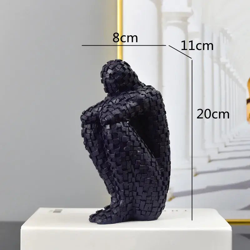 Black mosaic textured figurine of a seated golden man thinker 20cm tall abstract statue for living room decor