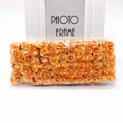 A package of orange decorbites 144pcs 2cm artificial paper roses neatly arranged and sealed for wedding decor