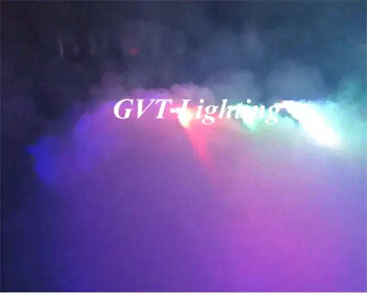 A vibrant multicolor black led mini stage smoke machine emitting red green and blue beams through swirling smoke for parties