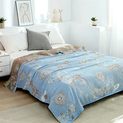 Light blue fleece blanket with cozy deer and floral pattern in earthy tones featured in decorbites boho printed style