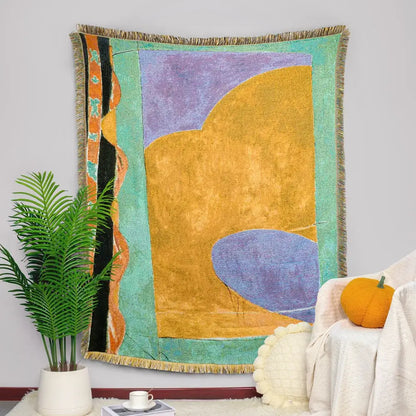 Colorful multicolor patchwork striped jacquard tapestry blanket with bold purple yellow and teal geometric shapes and fringed edges