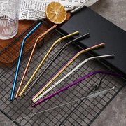 Set of multicolor stainless steel reusable straws in blue gold black silver and purple for kitchen dining use