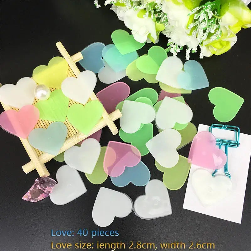 Pastel-colored heart-shaped resin stickers in soft pink green blue and white for stars glow dark wall bedroom decor