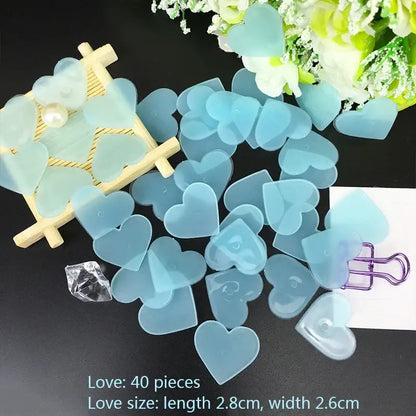 Translucent light blue heart-shaped resin craft pieces paired with glow dark wall multicolor stars for luminous bedroom decor