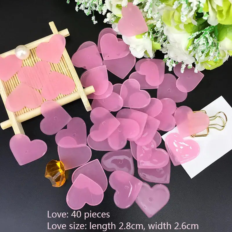 Pink translucent heart-shaped resin beads with glossy and gradient finish for multicolor stars glow dark wall stickers decor