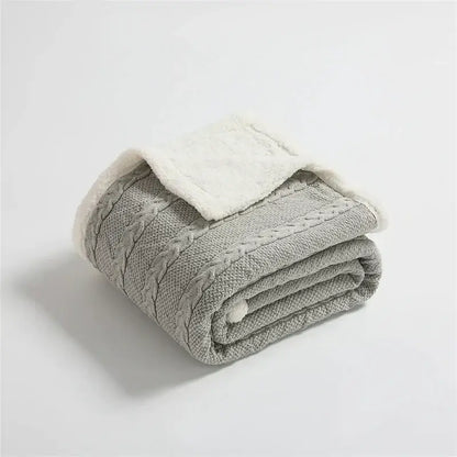 Gray cable knit sherpa blanket with plush white lining by decorbites for cozy bedroom decor and warmth