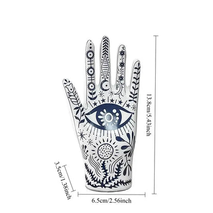 Mystic white and blue ceramic hand jewelry holder stand with intricate navy blue mystical patterns and celestial motifs