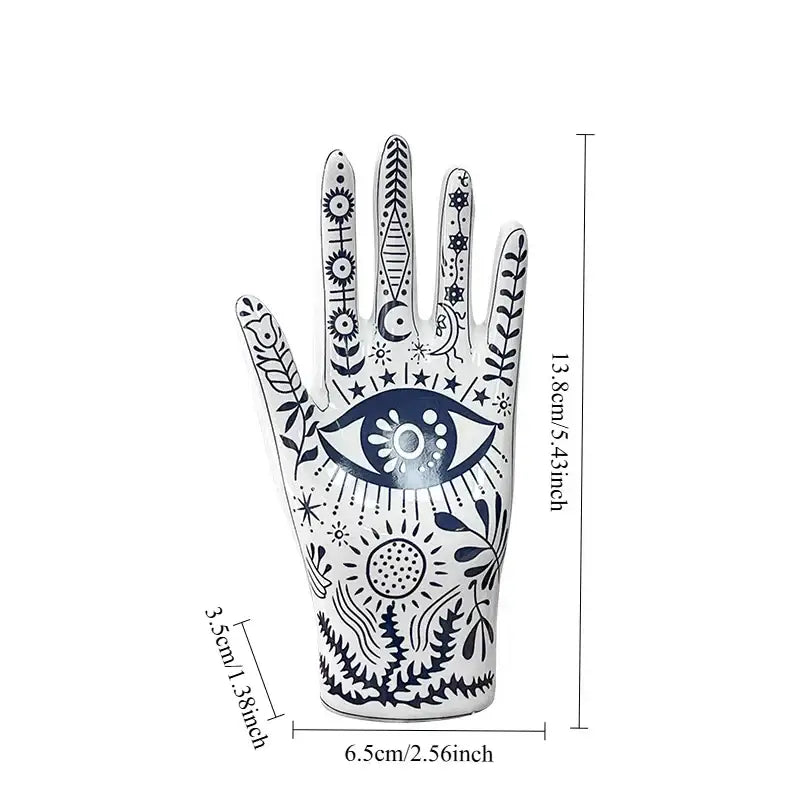 Mystic white and blue ceramic hand jewelry holder stand with intricate navy blue mystical patterns and celestial motifs