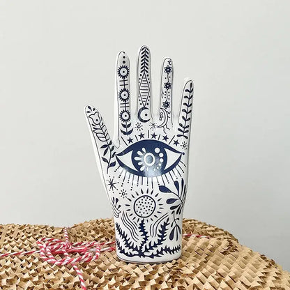 Mystic white and blue ceramic hand jewelry holder stand with intricate navy eye and floral patterns for bedroom decor