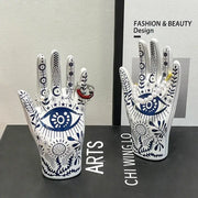 Mystic white and blue ceramic hand jewelry holder stand with intricate patterns and central eye motif for bedroom decor