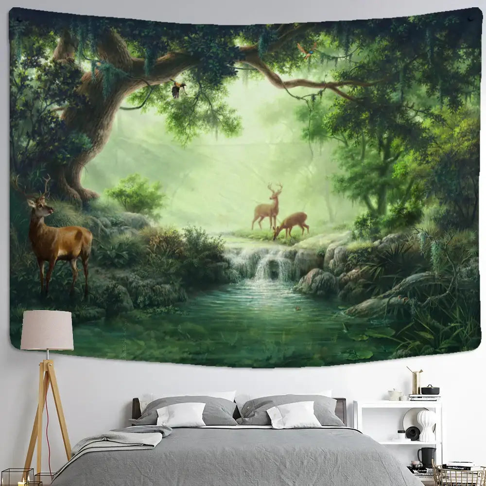 Mystical elk tapestry wall hanging featuring a lush green forest with elk, waterfall, and mossy trees above a bed
