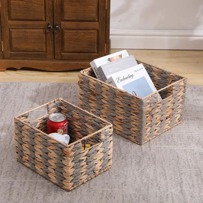 Two natural brown and gray woven rattan storage baskets with textured interlaced pattern by decorbites