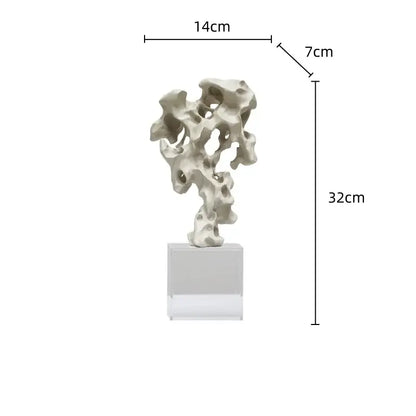 A sleek off-white resin taihu stone coral sculpture with organic contours on a clear base for living room decorbites green taihu