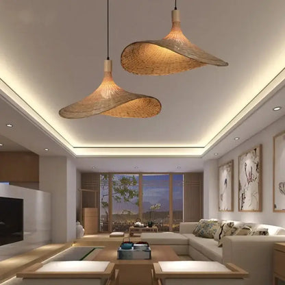 Two elegant light brown bamboo wicker chandelier pendant lights with a natural design hang from the ceiling