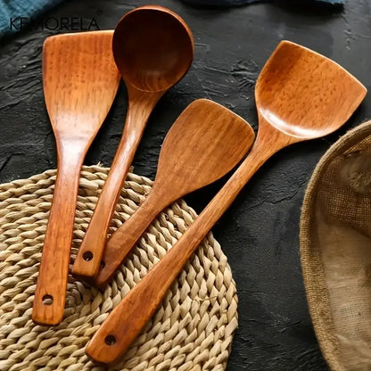 Set of four natural polished wooden kitchen utensils with smooth ergonomic handles kitchen utensil set