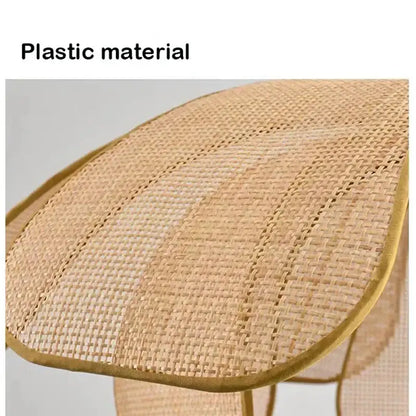 Beige woven plastic chair with gold-trimmed edges complementing natural rattan woven pendant light for dining room