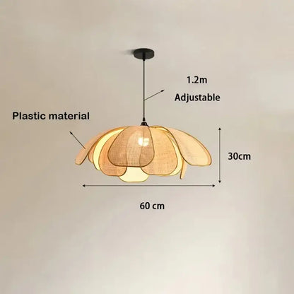 Warm-toned natural rattan pendant light with plastic flower-shaped layered petals as a light source for dining room