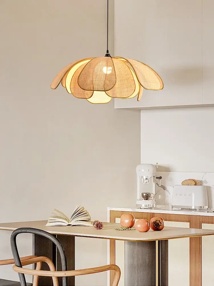 A warm-toned natural rattan woven pendant light with layered petals for dining room ceiling
