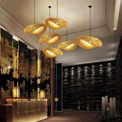 Natural woven golden bamboo pendant light with warm glowing illumination for dining room decorbites bamboo pendant