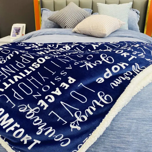 Navy and cream decorbites cozy printed flannel blanket with white cursive patterns and fleece border for living room use