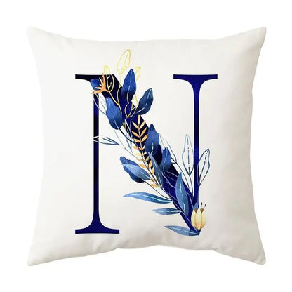 White throw pillow with navy blue alphabet flower letter n featuring decorbites blue alphabet foliage for bedroom decor