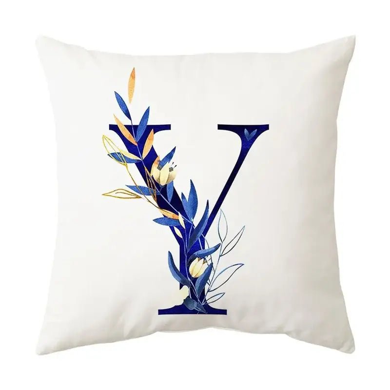 White throw pillow featuring navy and gold alphabet flower letter y with decorbites blue alphabet foliage design for decor
