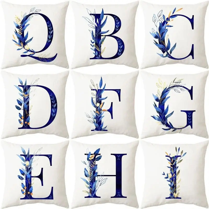 Set of nine white throw pillows with navy and gold blue alphabet flower letter designs for bedroom decorbites decor