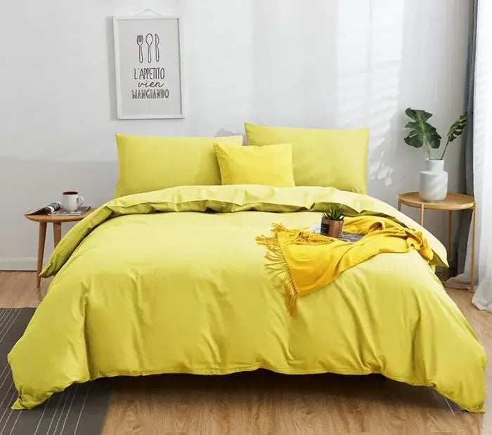 Bright yellow duvet set with matching pillows and coordinating throw in a solid color decorbites cotton 4pcs bedding set