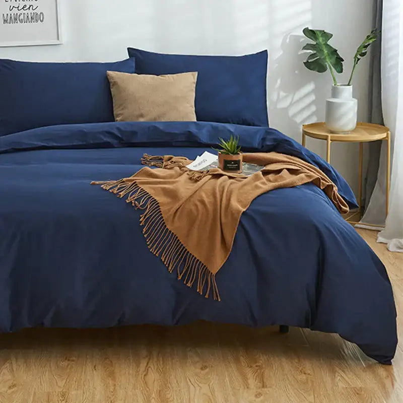 Navy blue solid color decorbites cotton 4pcs bedding set with tan throw blanket and matching pillowcases for bedroom