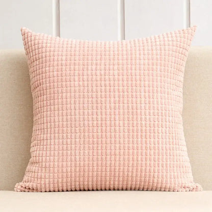 A soft pink waffle-textured throw pillow with plush corduroy fabric for decorbites corduroy corn grain cushion cover set